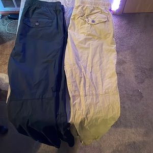 Two cargo/jogger pants, one black and one tan in great condition with no rips